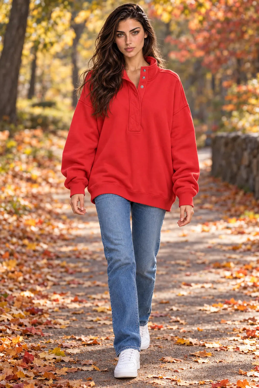 Woman in the Gacaky red oversized Henley sweatshirt on a park path