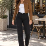 Cropped Stretch Denim Jacket Review: luvamia Woman at a cafe table wearing the luvamia brown cropped denim jacket